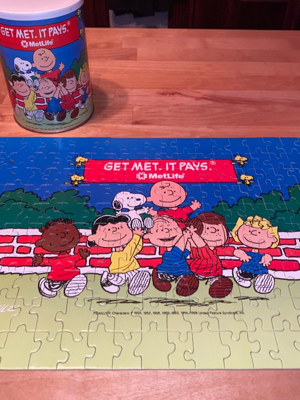 Vintage 90s Met Life Snoopy Peanuts puzzle in a can